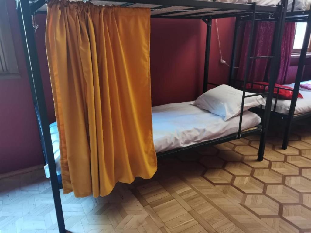 Postel nebo postele na pokoji v ubytování European Backpackers Hostel and 大廚房