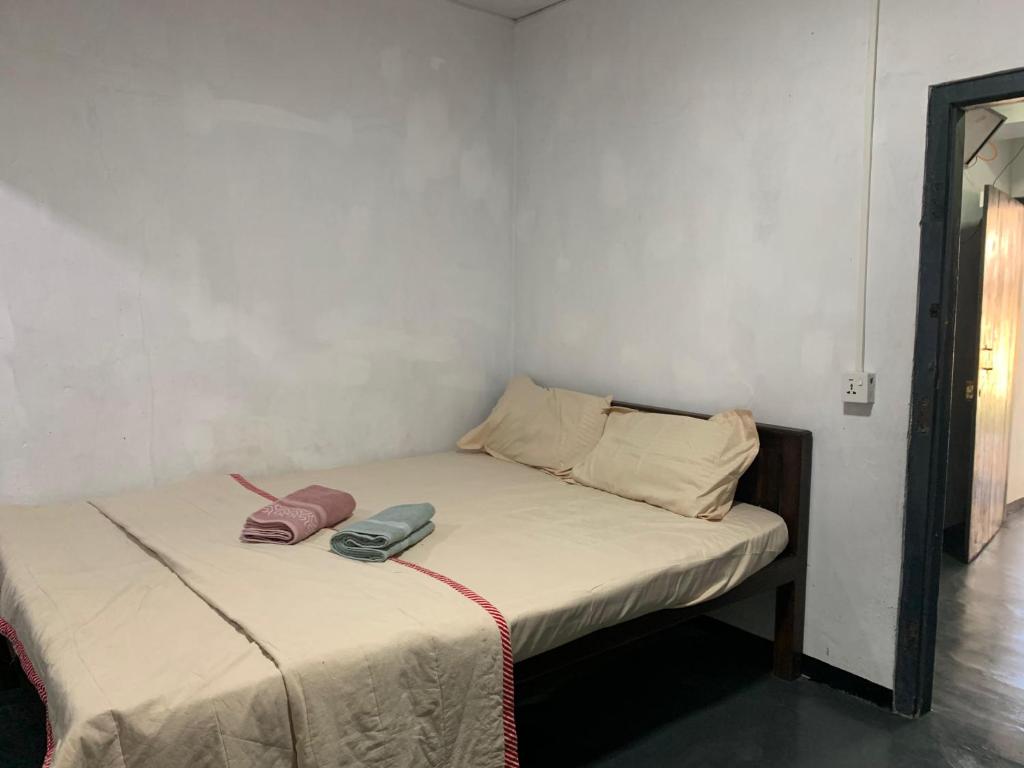 Postel nebo postele na pokoji v ubytování Hotel Surfing