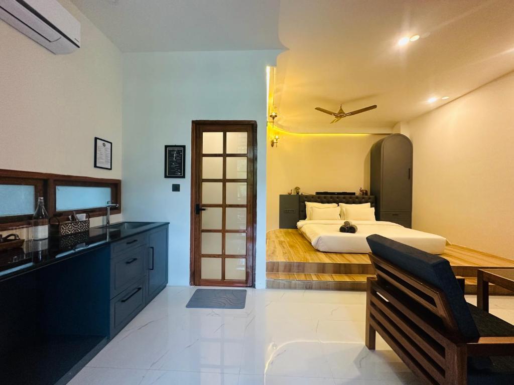 a large bedroom with a bed and a plane on the wall at Roys Villa Havelock in Havelock Island