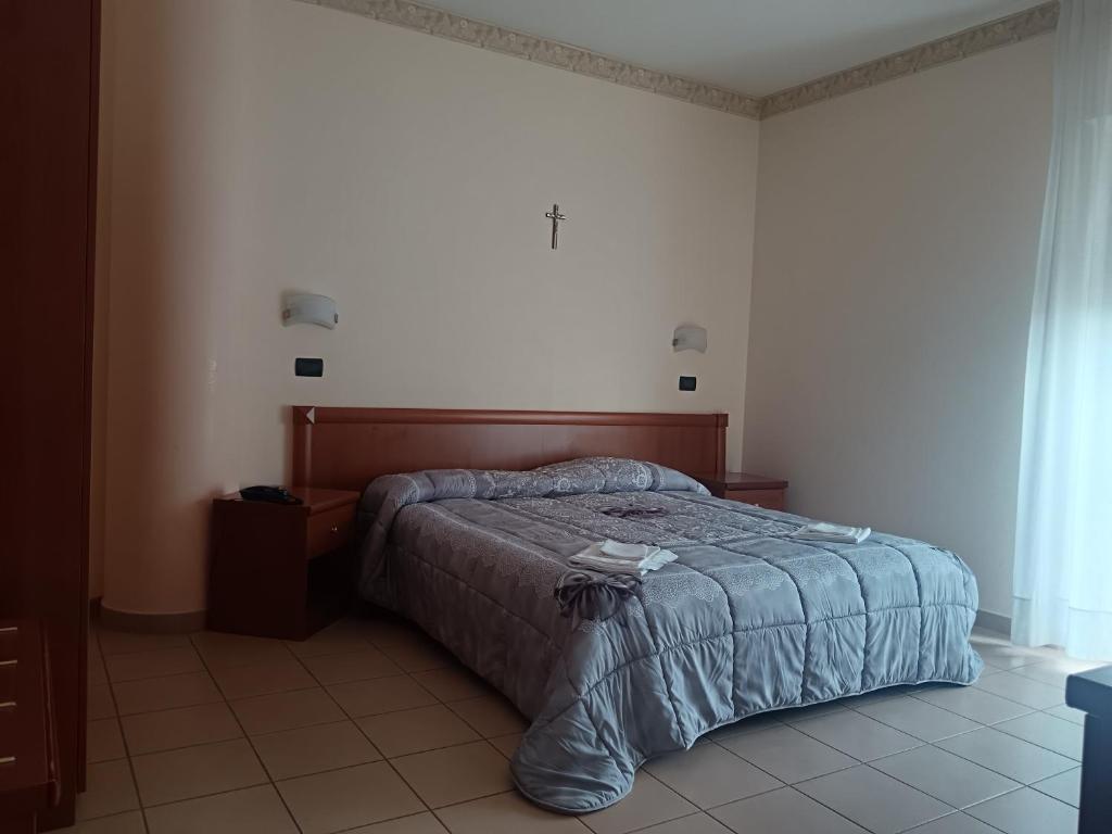 Postel nebo postele na pokoji v ubytování Hotel Sirios