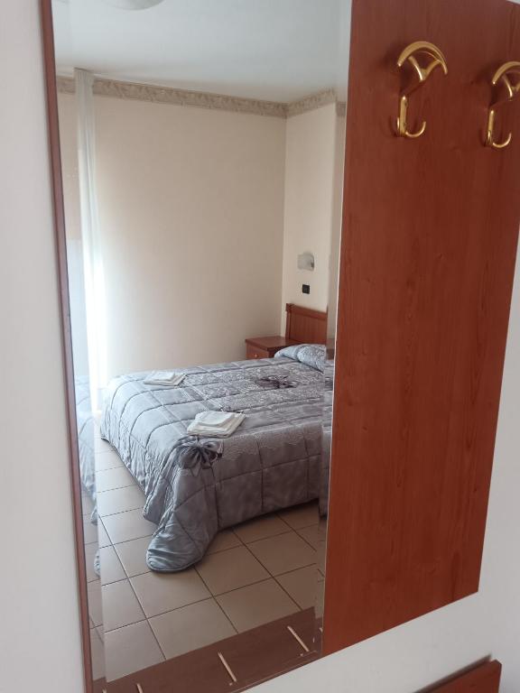 Postel nebo postele na pokoji v ubytování Hotel Sirios