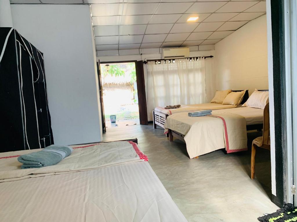 Postel nebo postele na pokoji v ubytování Hotel Surfing