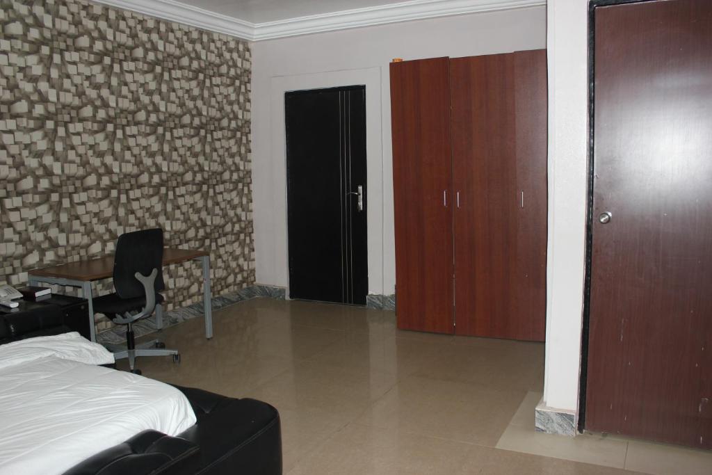 Postel nebo postele na pokoji v ubytování Adbates Suites and Recreation