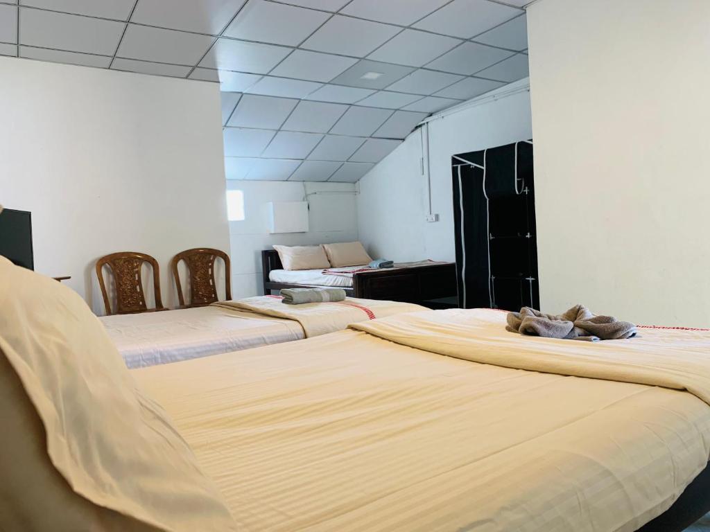 Postel nebo postele na pokoji v ubytování Hotel Surfing