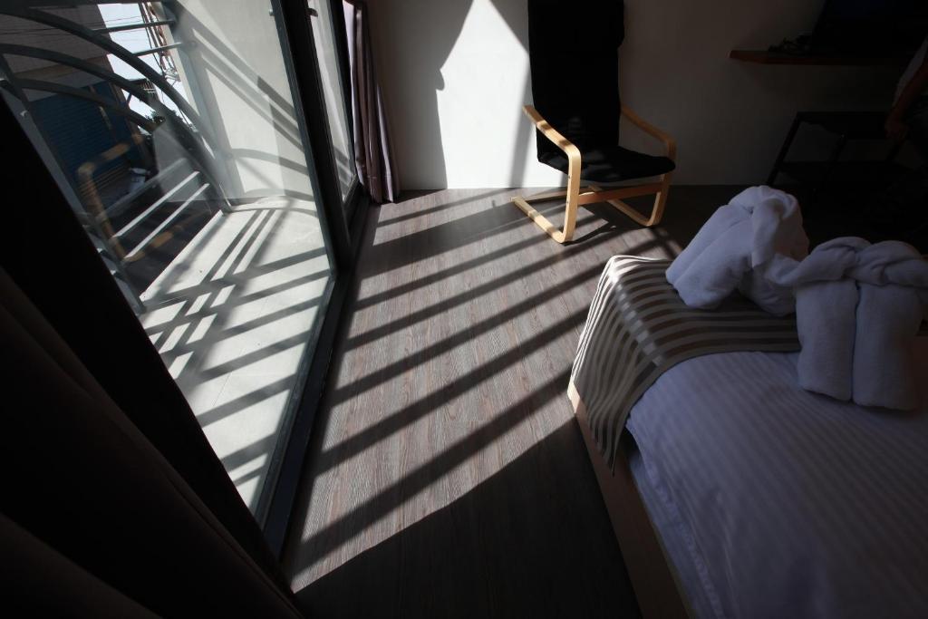 Postel nebo postele na pokoji v ubytování Bai Ji Yi B&B