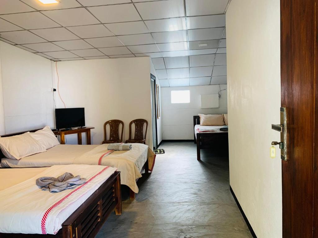 Postel nebo postele na pokoji v ubytování Hotel Surfing