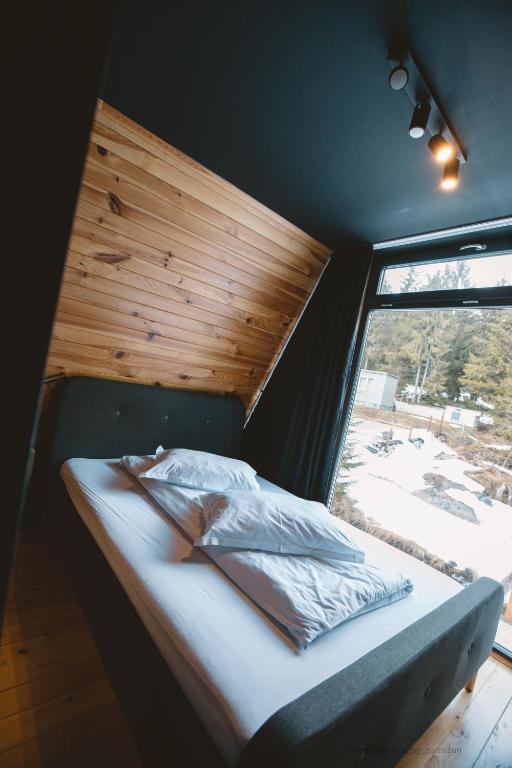 Postel nebo postele na pokoji v ubytování Black Chalet