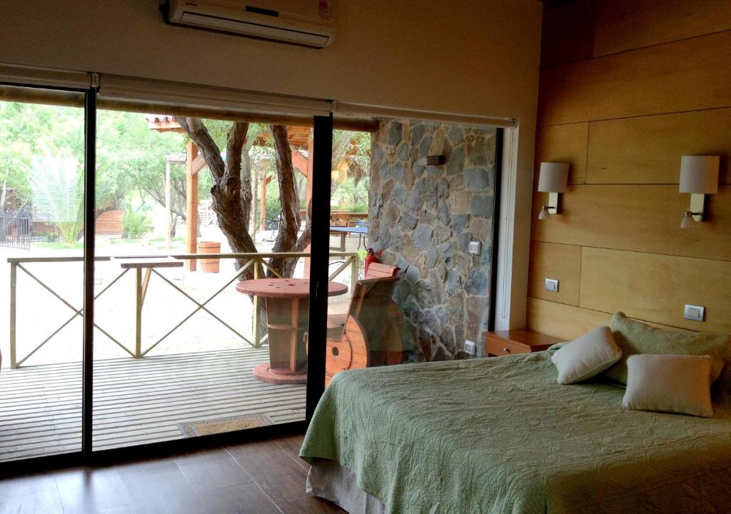 Postel nebo postele na pokoji v ubytování Olmue Natura Lodge & Spa