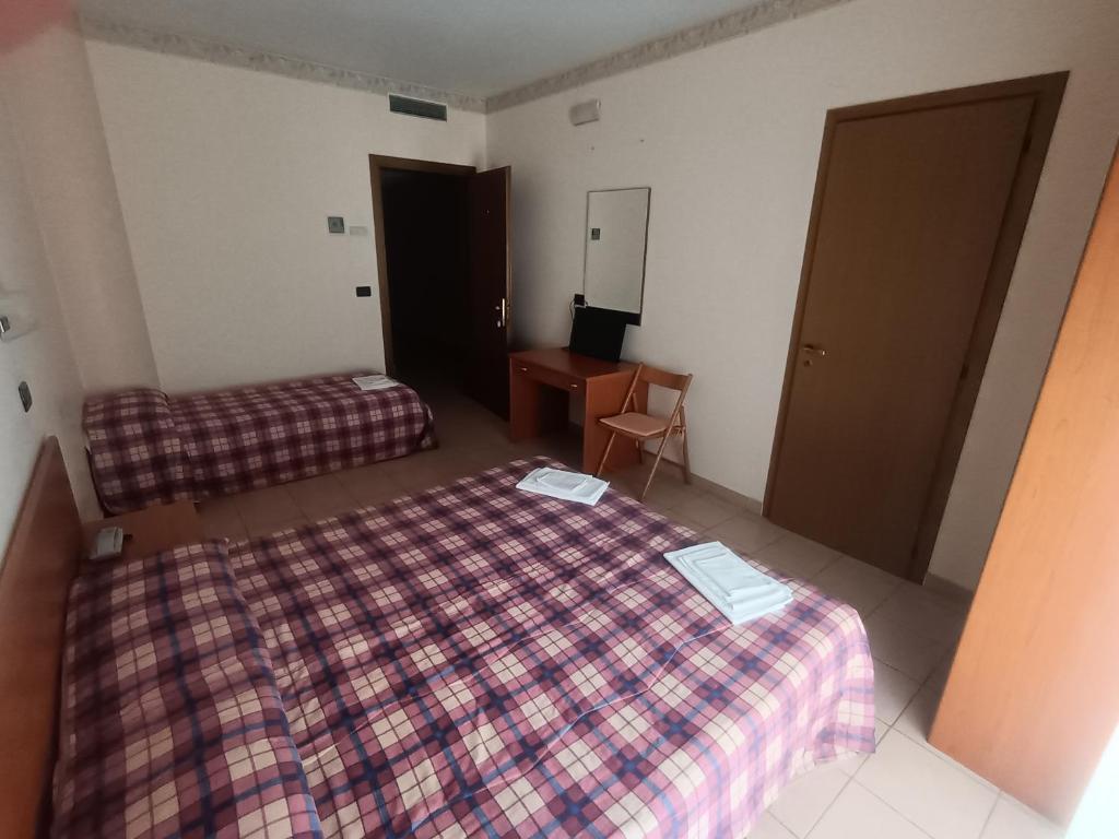 Postel nebo postele na pokoji v ubytování Hotel Sirios