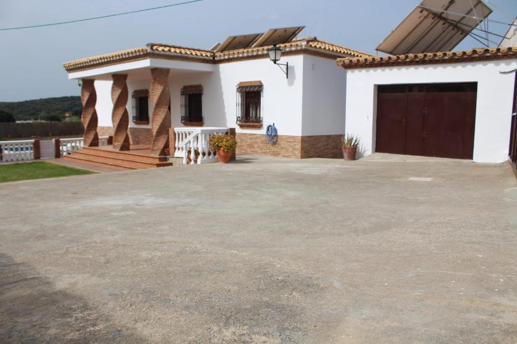 a house with a large driveway in front of it at Matilde&Leire in Barbate