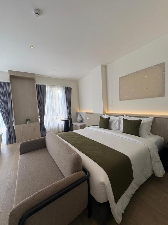 Postel nebo postele na pokoji v ubytování Hotel Whitt Hua Hin