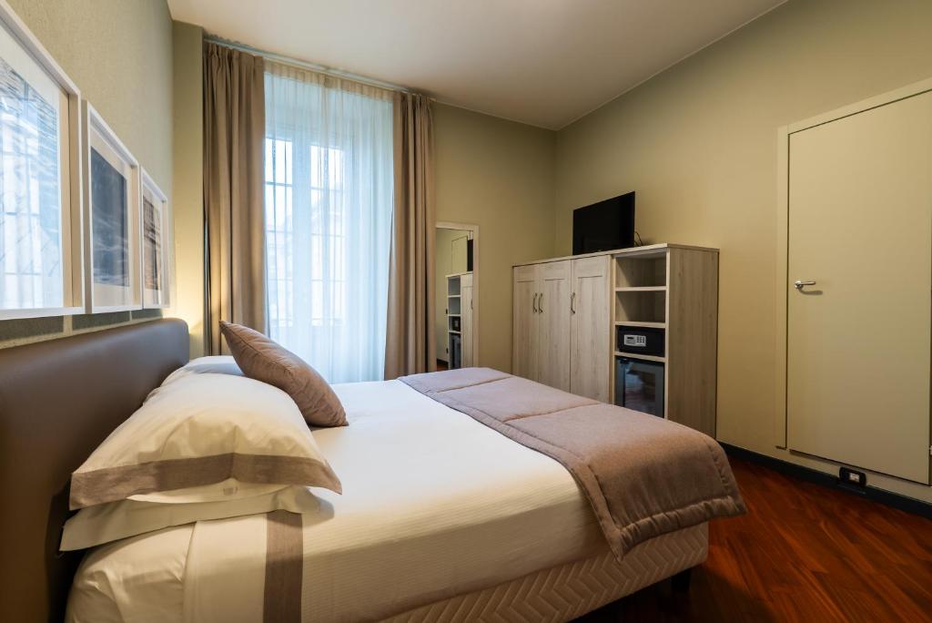 Postel nebo postele na pokoji v ubytování Hotel Centrale