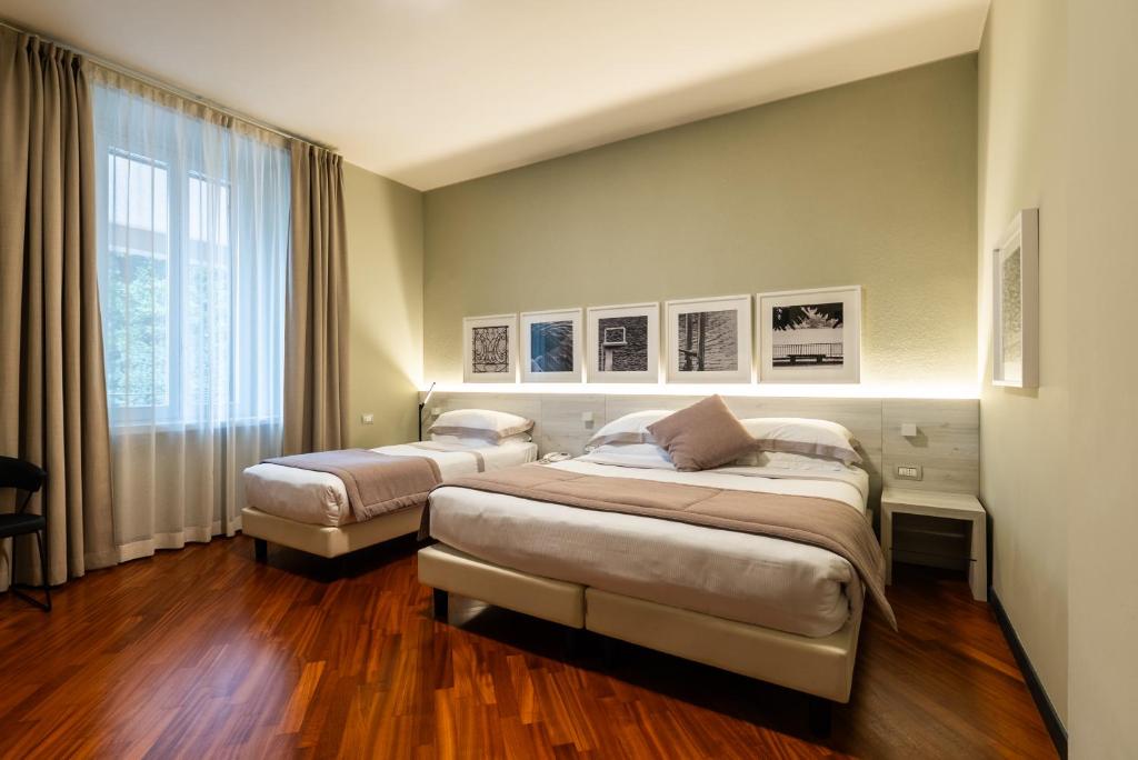 Postel nebo postele na pokoji v ubytování Hotel Centrale