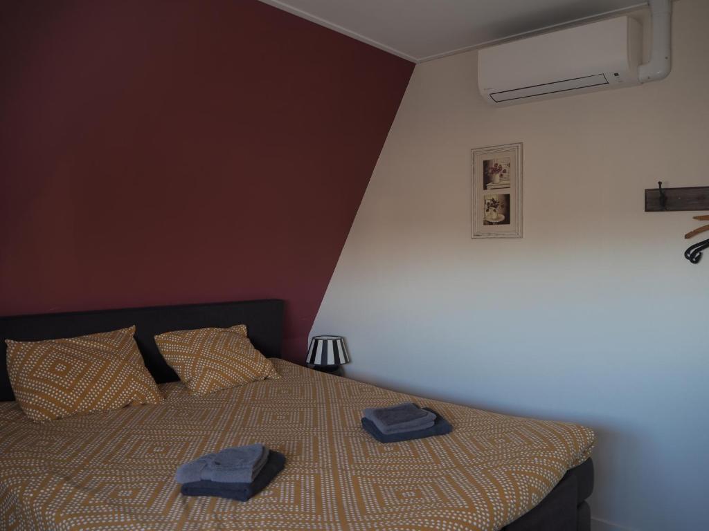 Postel nebo postele na pokoji v ubytování Hotel de Harmonie