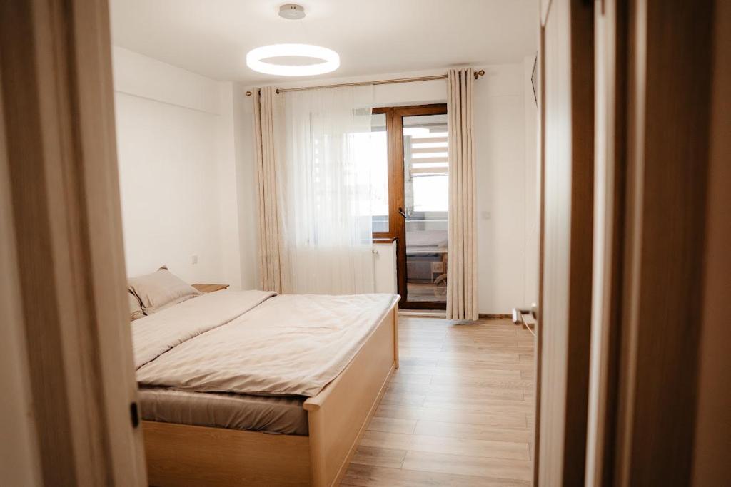 Ένα ή περισσότερα κρεβάτια σε δωμάτιο στο Als apartament