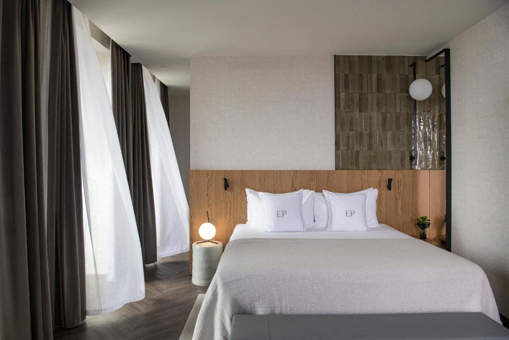 Postel nebo postele na pokoji v ubytování Europa Palace