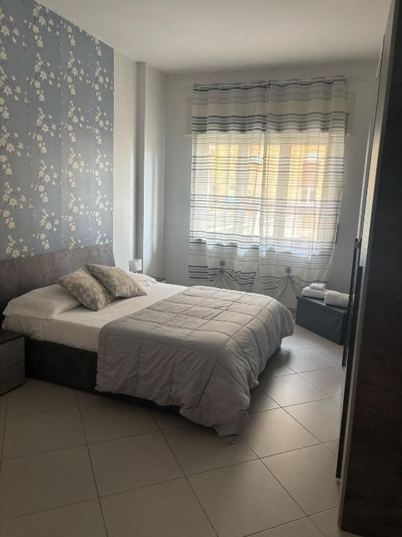 Postel nebo postele na pokoji v ubytování Holiday Garibaldi