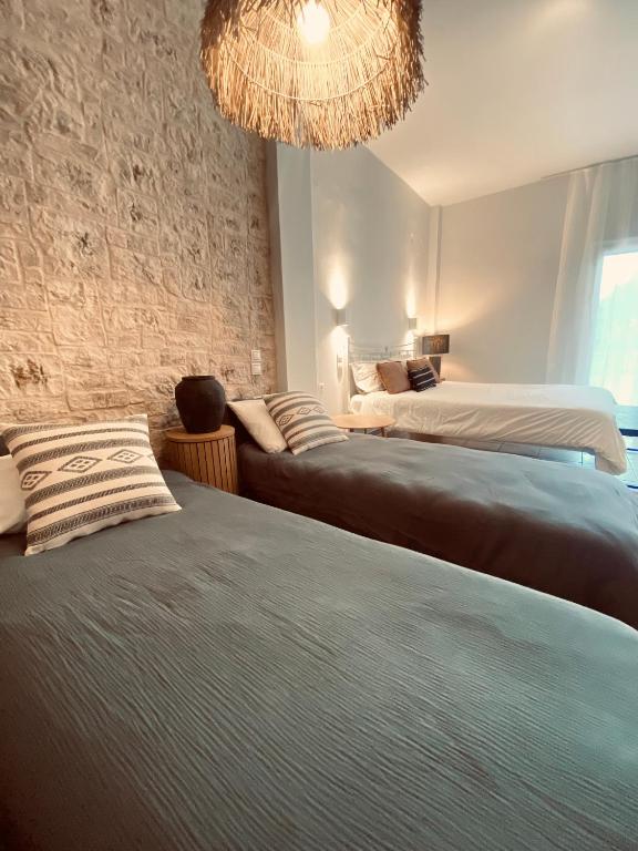 Postel nebo postele na pokoji v ubytování KIPOS-SS residences
