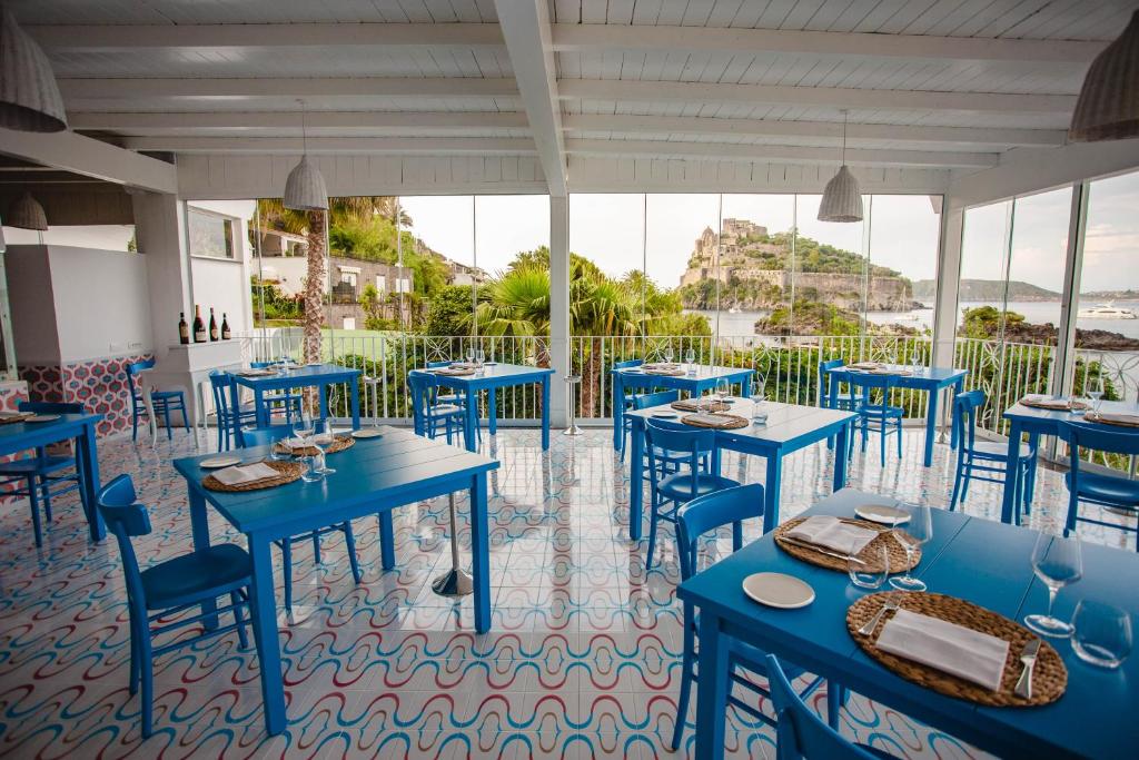 מסעדה או מקום אחר לאכול בו ב-Strand Hotel Delfini