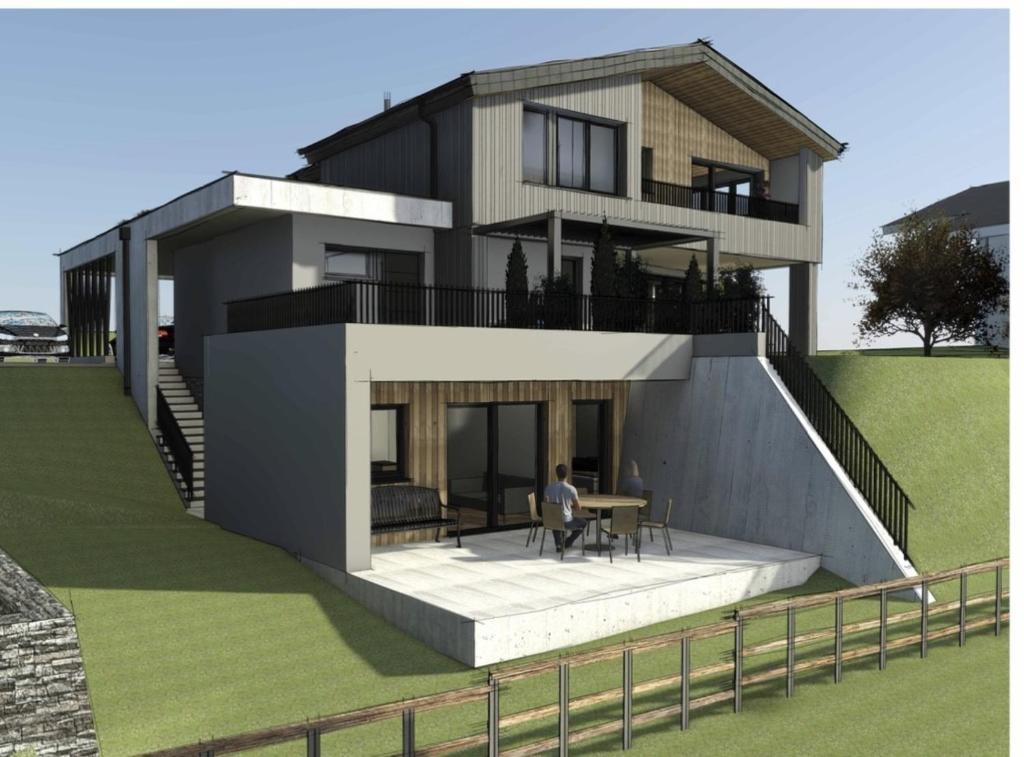 a rendering of a house with a person sitting at a table at The HIDDEN Apartment in Flachau