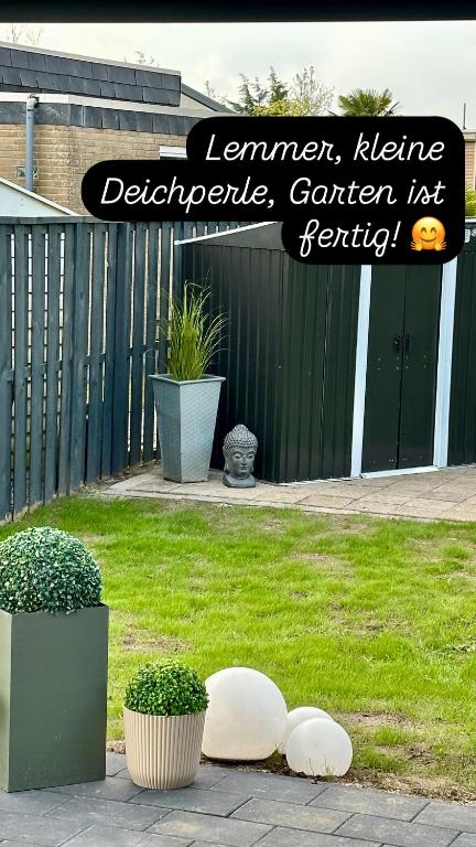 Zahrada ubytování Bungalow kleine Deichperle, Strand und Deich in unmittelbarer Nähe!