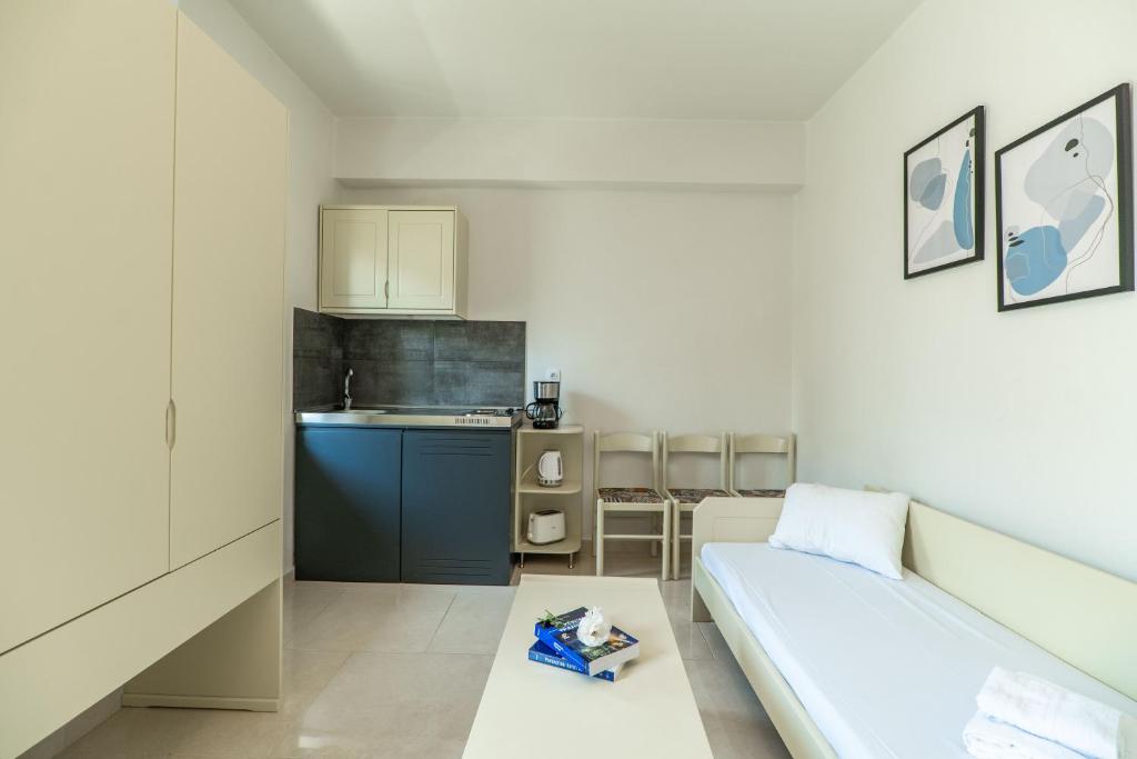 Postel nebo postele na pokoji v ubytování Rhoe Seaside Apartments