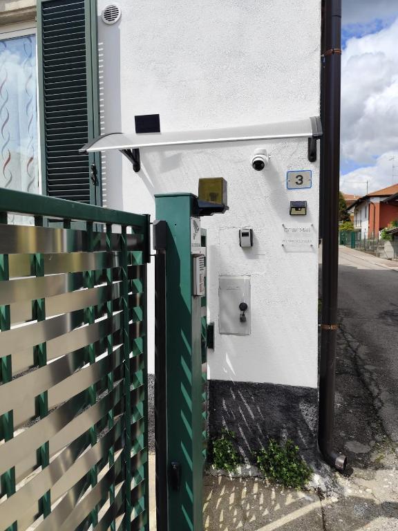 a gas pump on the side of a building at Ca' de' Mari at Como - Switzerland - Private Parking - Self Check-In in Faloppio