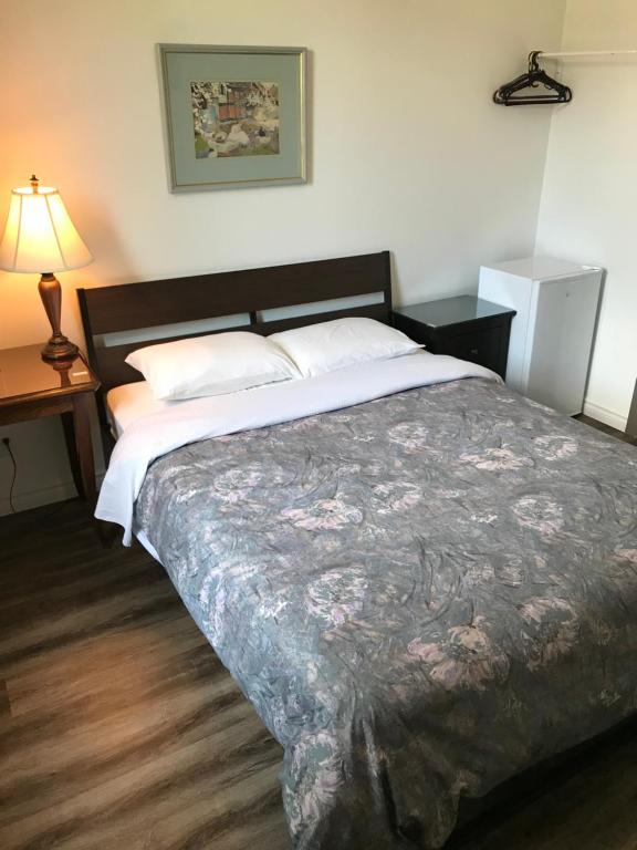 Postel nebo postele na pokoji v ubytování Hotel Bon Accueil