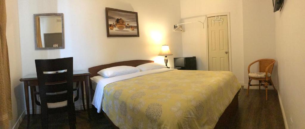 Postel nebo postele na pokoji v ubytování Hotel Bon Accueil