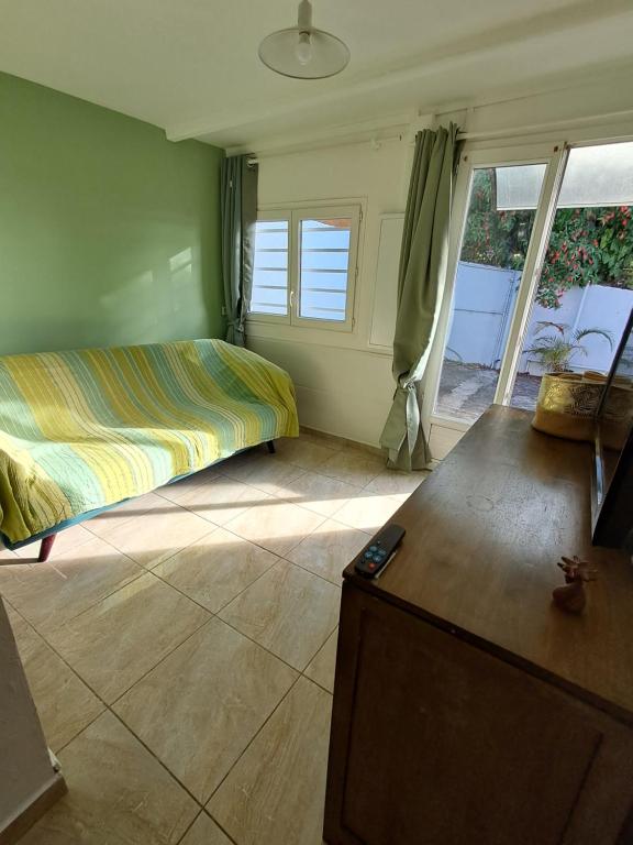 Postel nebo postele na pokoji v ubytování Le Tranqu'Île