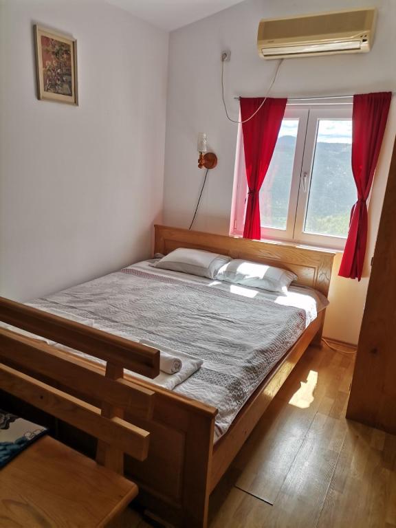 Postel nebo postele na pokoji v ubytování Tri bagrema KM