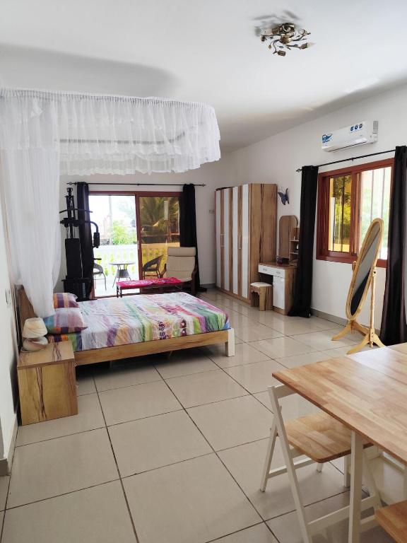 Postel nebo postele na pokoji v ubytování Villa Manamé, face à l'océan