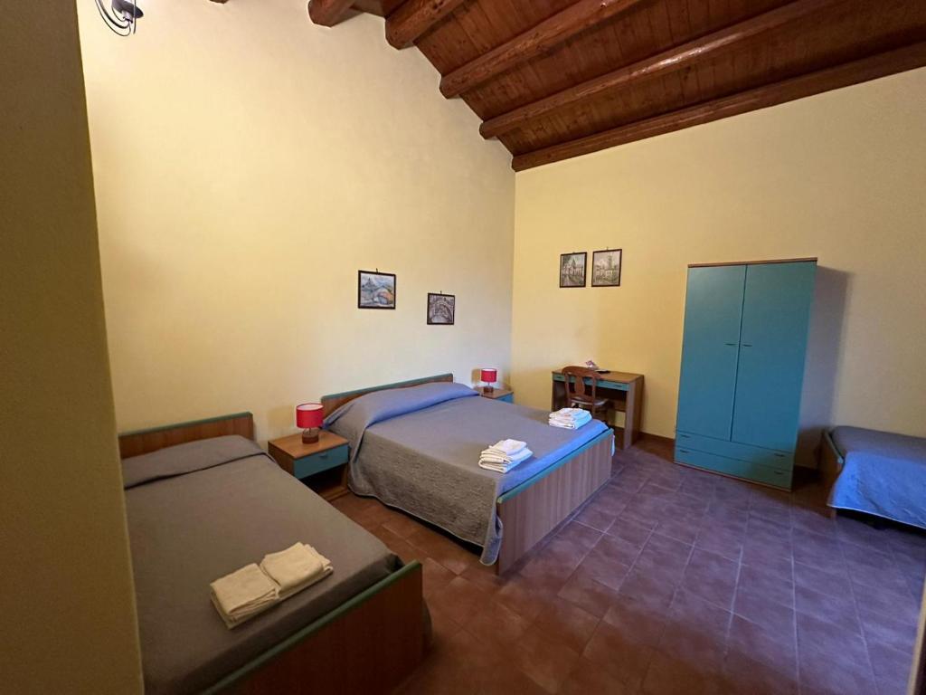 Postel nebo postele na pokoji v ubytování L'Antica Vigna