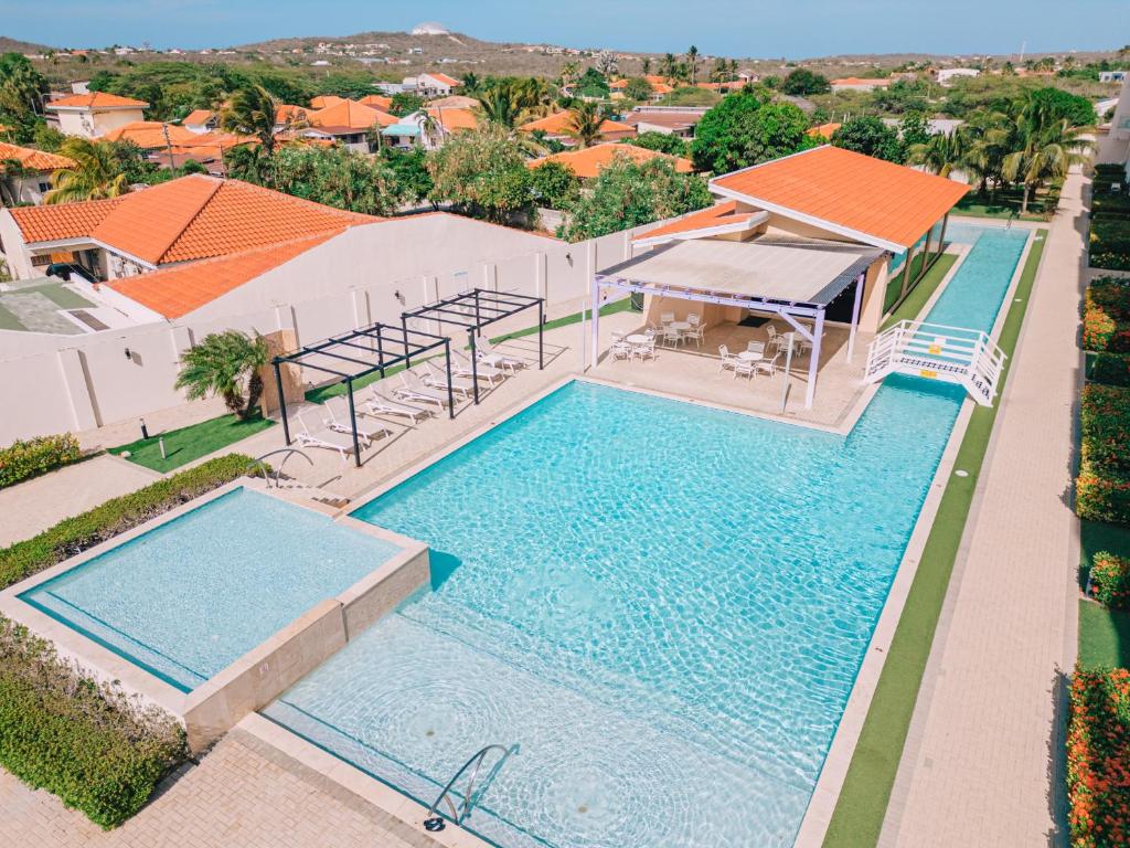 an overhead view of a swimming pool at a house at Aruba's Life Residences in Noord
