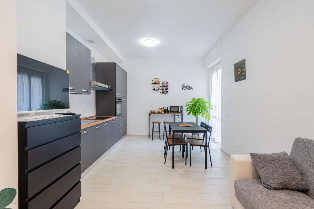 a kitchen and living room with a couch and a table at Casa Del Sole in Lanciano