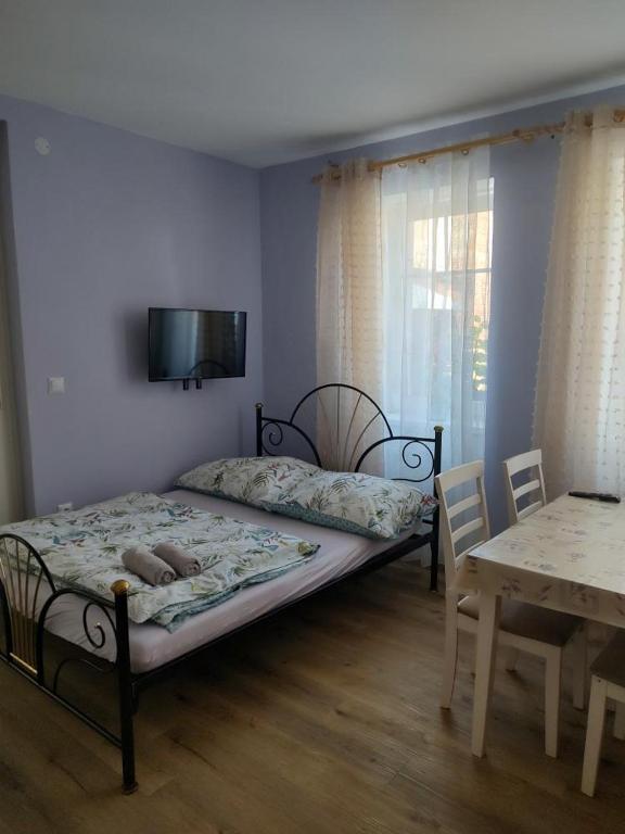 Postel nebo postele na pokoji v ubytování Hortenzie