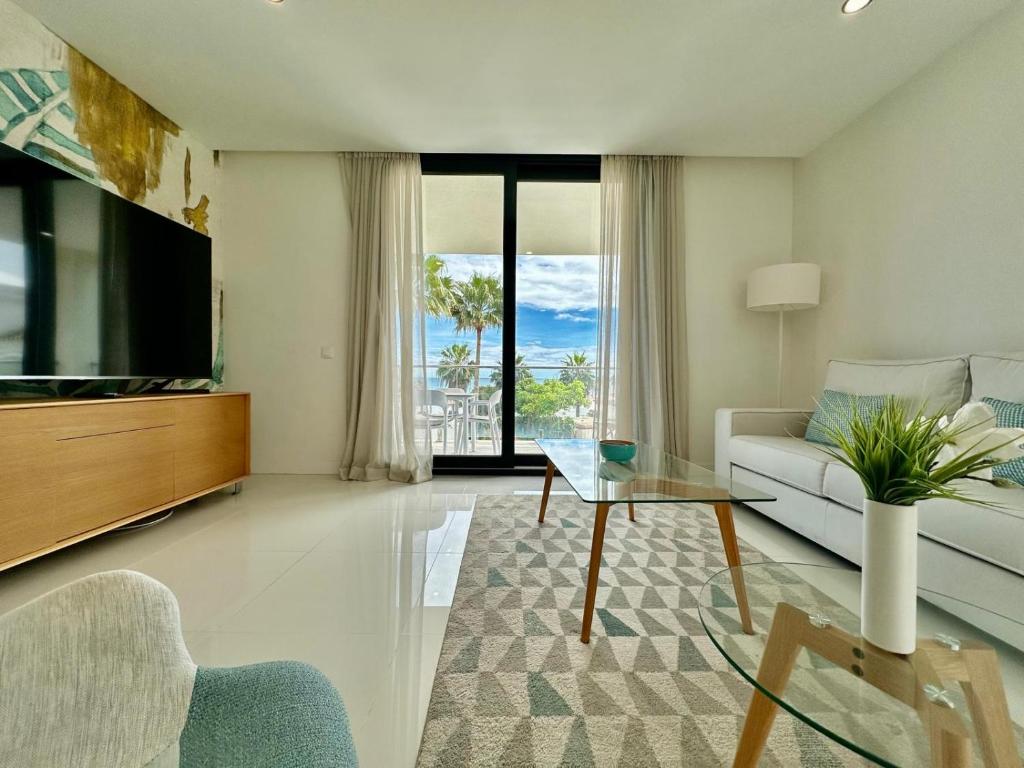 TV a/nebo společenská místnost v ubytování La Paloma Seaview Apartment