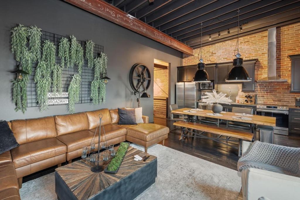 a living room with a brown couch and a table at Westside Escape in Cookeville