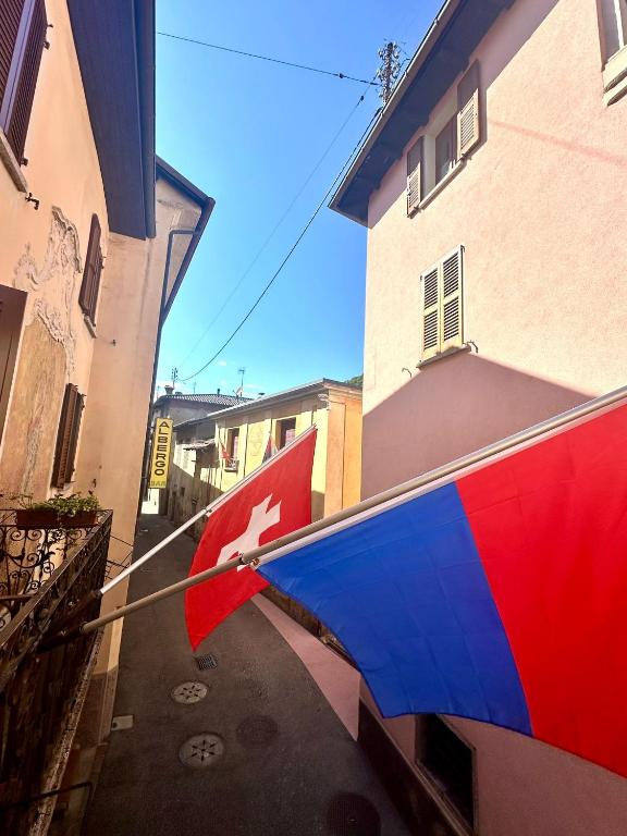 a flag of czech republic hanging from a building at Albergo della Posta in Astano
