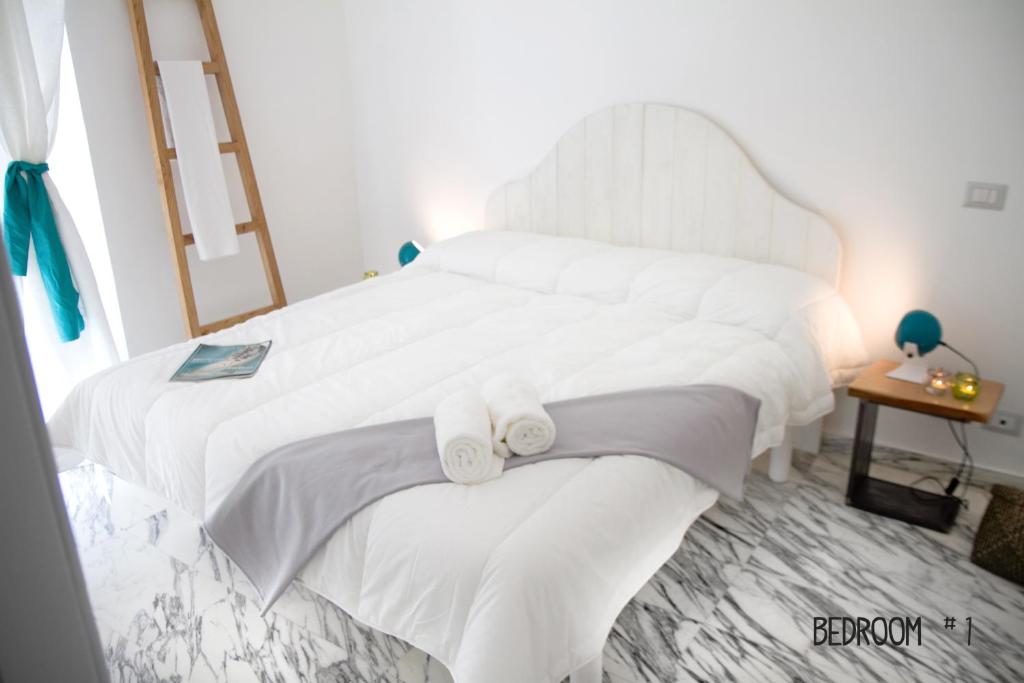 A bed or beds in a room at Abbituè Apartment