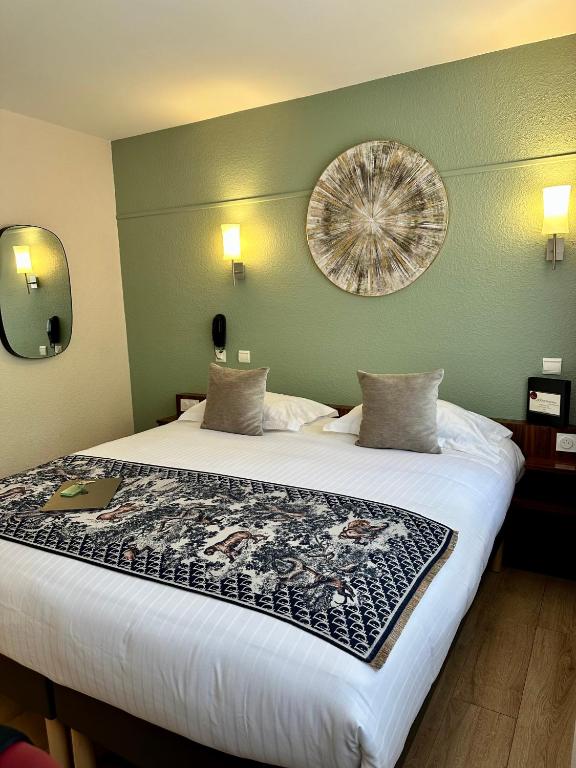 Postel nebo postele na pokoji v ubytování Hôtel Brun