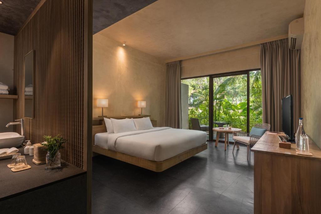 Postel nebo postele na pokoji v ubytování Amorita Resort Bohol