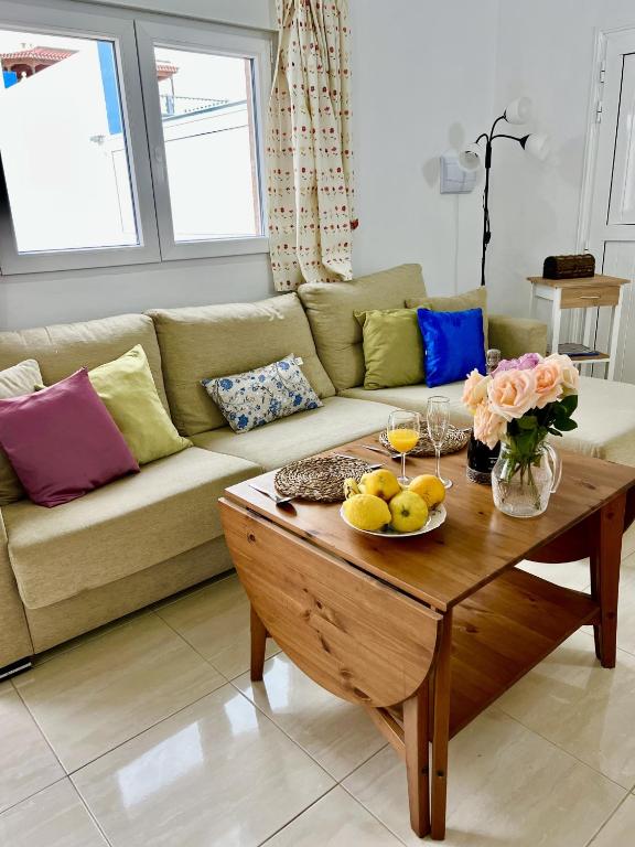 a living room with a couch and a coffee table at Buenavista - CHC - Mar Azul in Buenavista del Norte