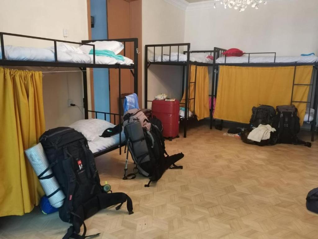 Postel nebo postele na pokoji v ubytování European Backpackers Hostel and 大廚房
