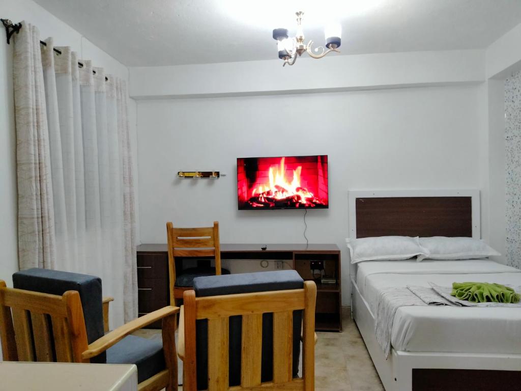 Postel nebo postele na pokoji v ubytování Nanyuki Cozy Haven