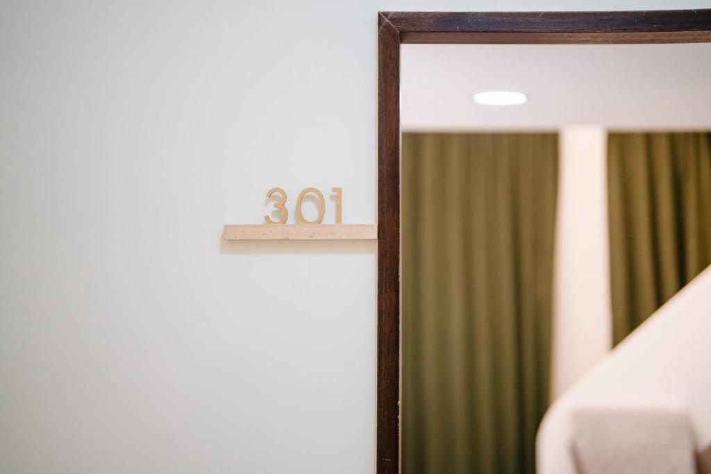 Postel nebo postele na pokoji v ubytování Shishi Homestay