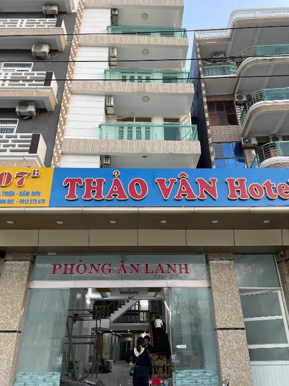 a sign for a tico van store in front of a building at Thảo Vân hotel in Sầm Sơn