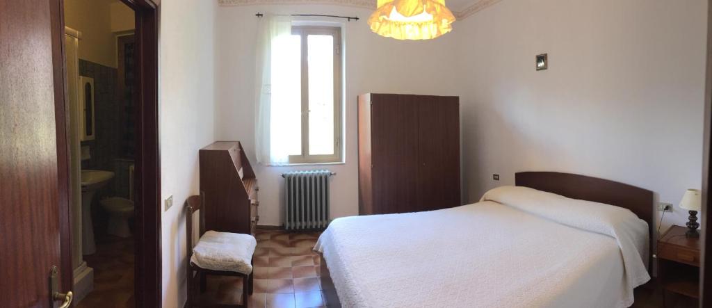 Postel nebo postele na pokoji v ubytování Albergo Ristorante La Selva