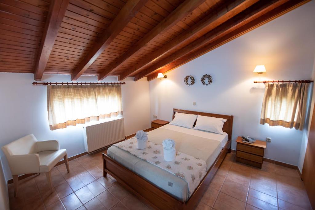 Postel nebo postele na pokoji v ubytování Mirmidones Corfu Apartment