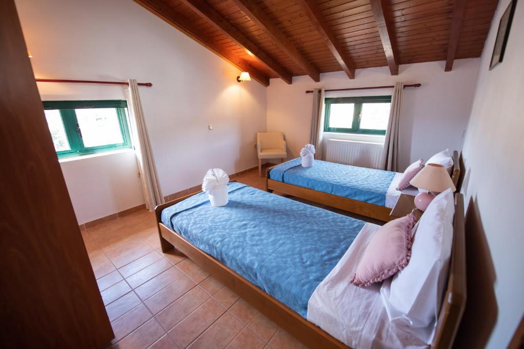 Postel nebo postele na pokoji v ubytování Mirmidones Corfu Apartment